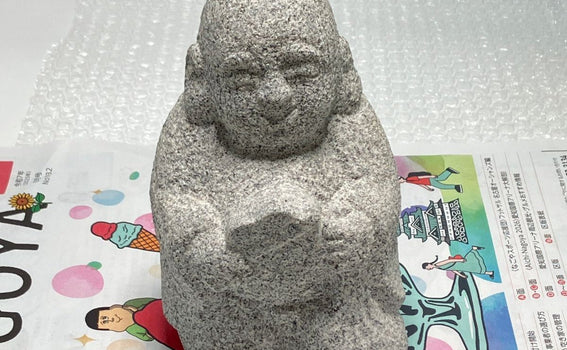 We shipped Hotei stone statue to Germany via UPS.