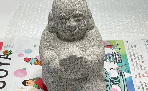 We shipped Hotei stone statue to Germany via UPS.